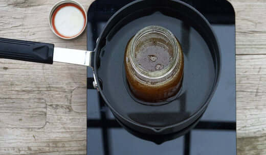 crystallized honey in a bath of warm water