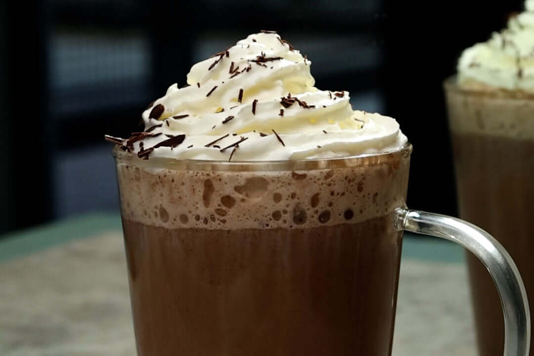 Irish Hot Chocolate with whipped cream and chocolate shavings on top