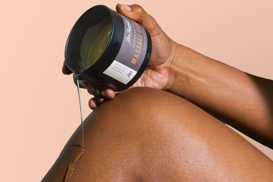 Woman applying massage oil to leg for cellulite treatment and circulation