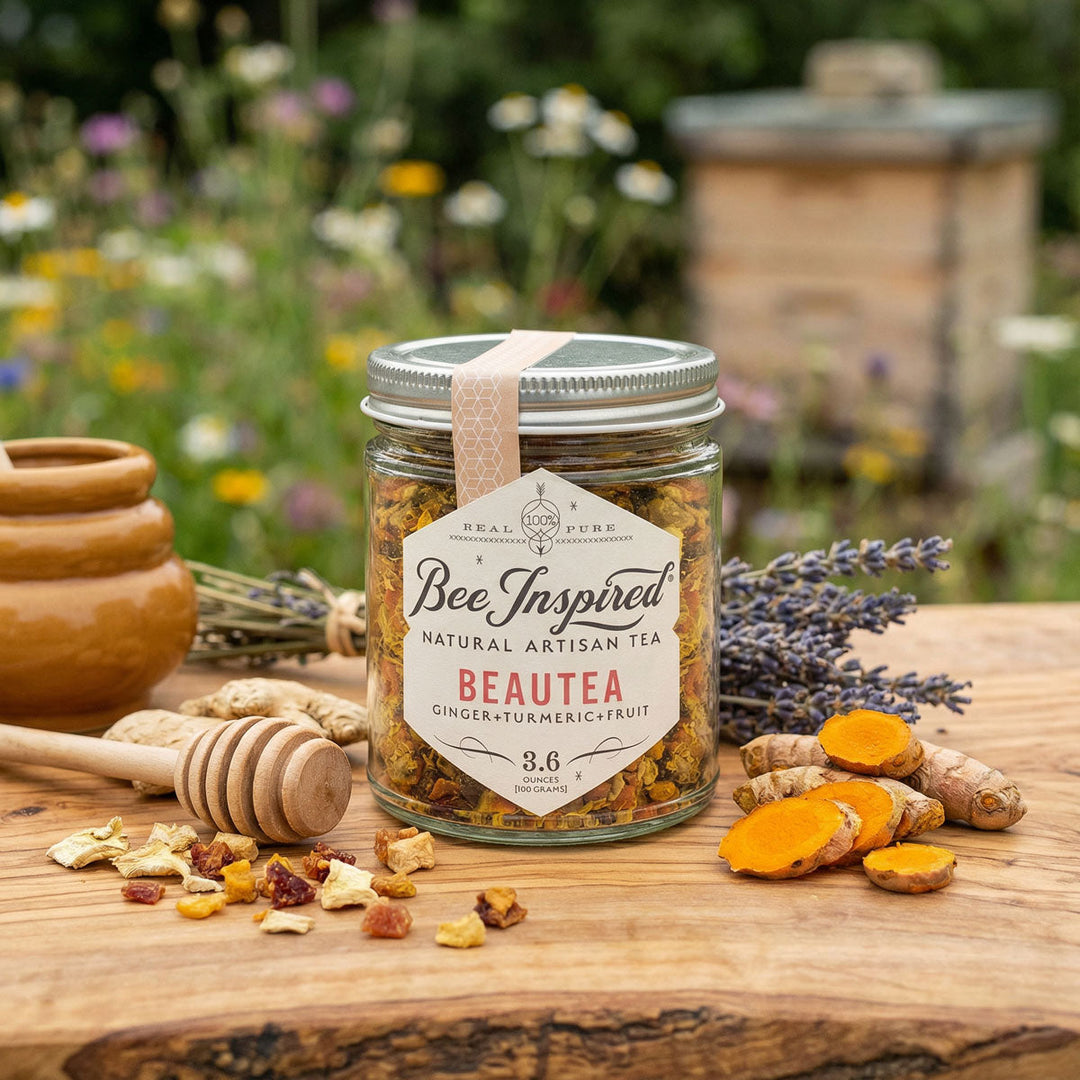 Jar of Bee Inspired Beautea natural artisan tea with ingredients on a wooden surface outdoors.