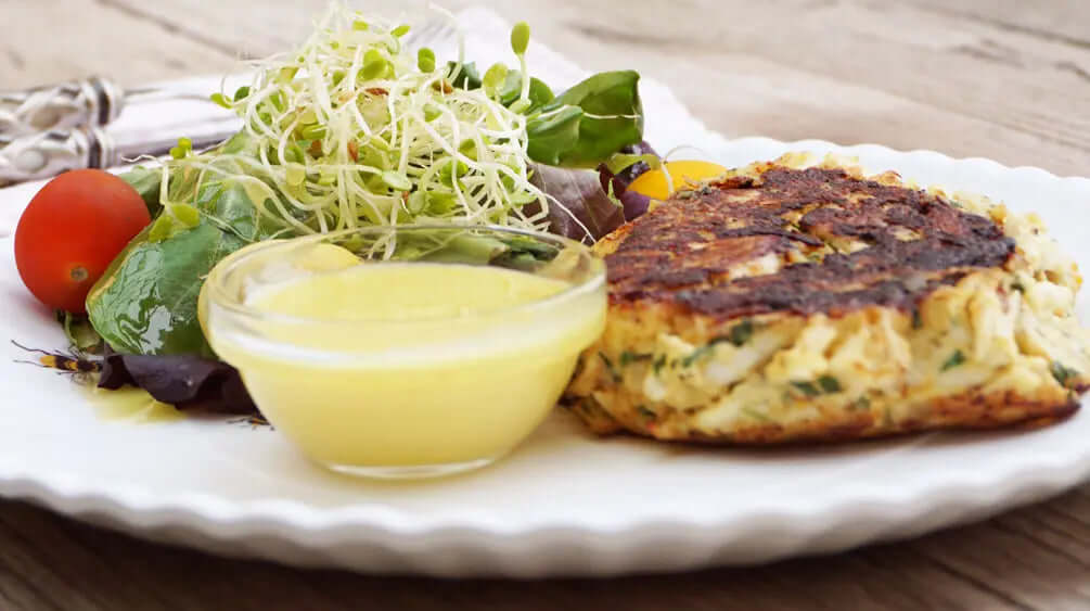 crab cake with salad on a plate