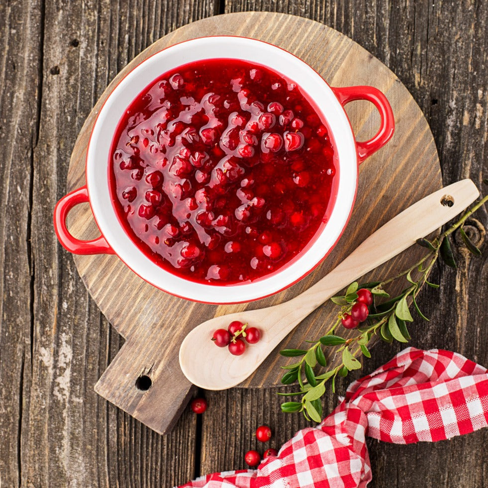 cranberry relish in bowl on wood with gingham napkin