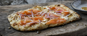 smoked salmon pizza on wood