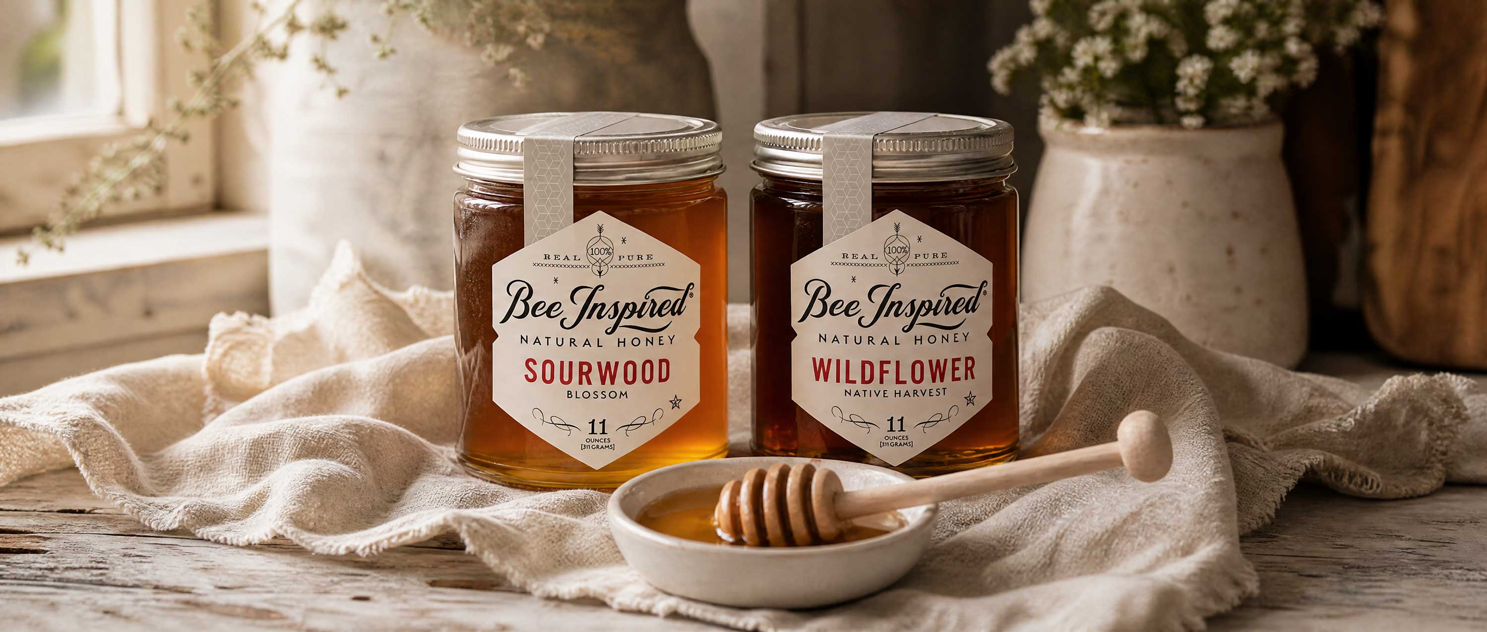 farmhouse table that features sourwood honey and wildflower honey and dish with honey and honey dipper