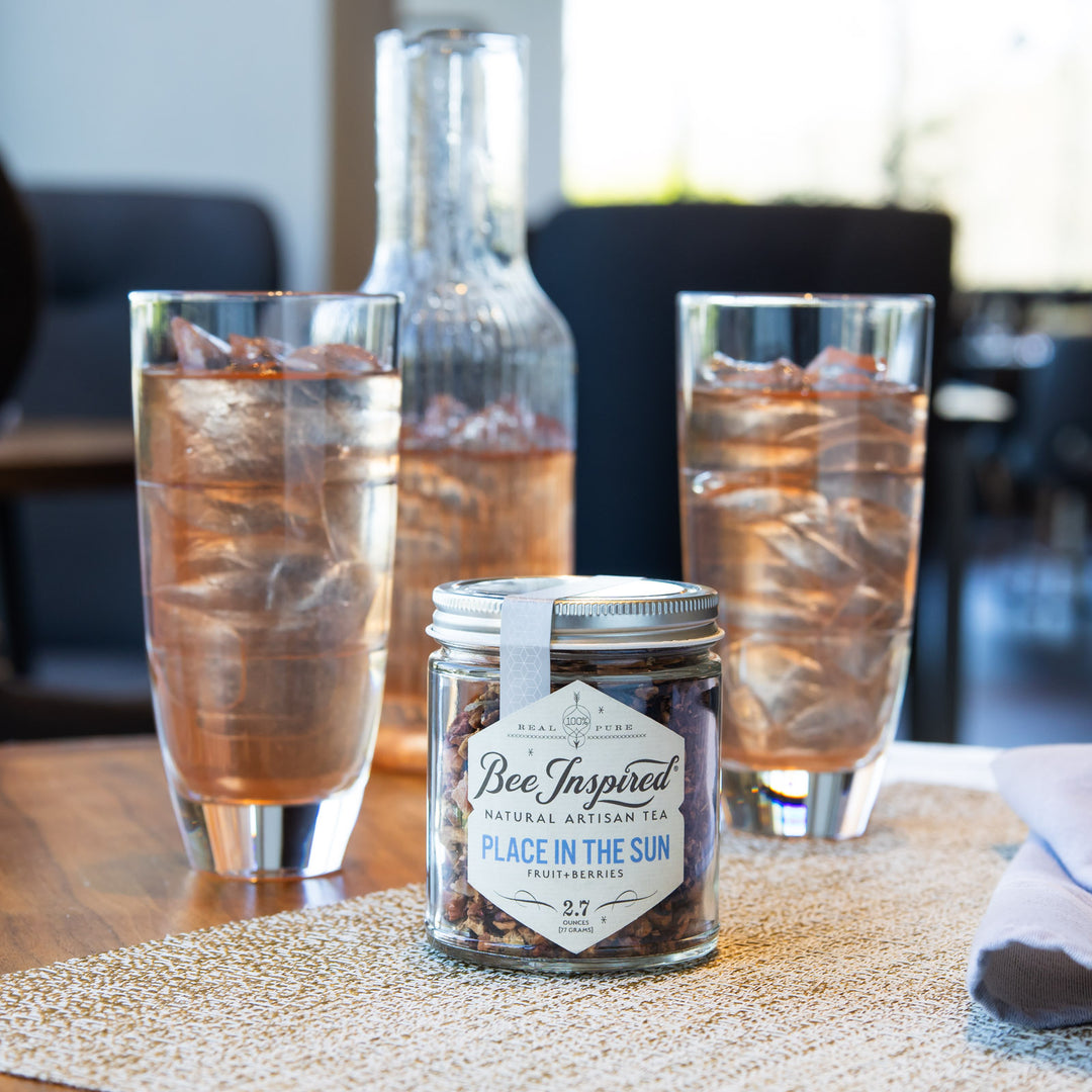 Place in the Sun loose leaf tea with brewed iced tea in glasses