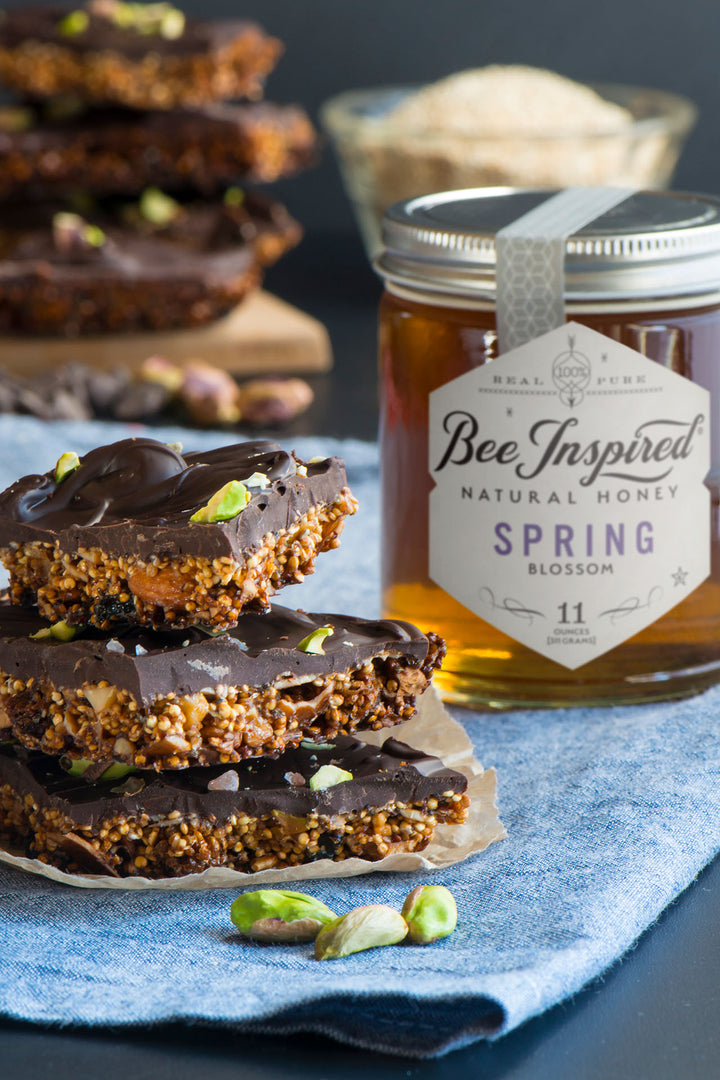 Squares of honey pistachio chocolate bark with Spring honey from bee inspired honey retail store in owings mills