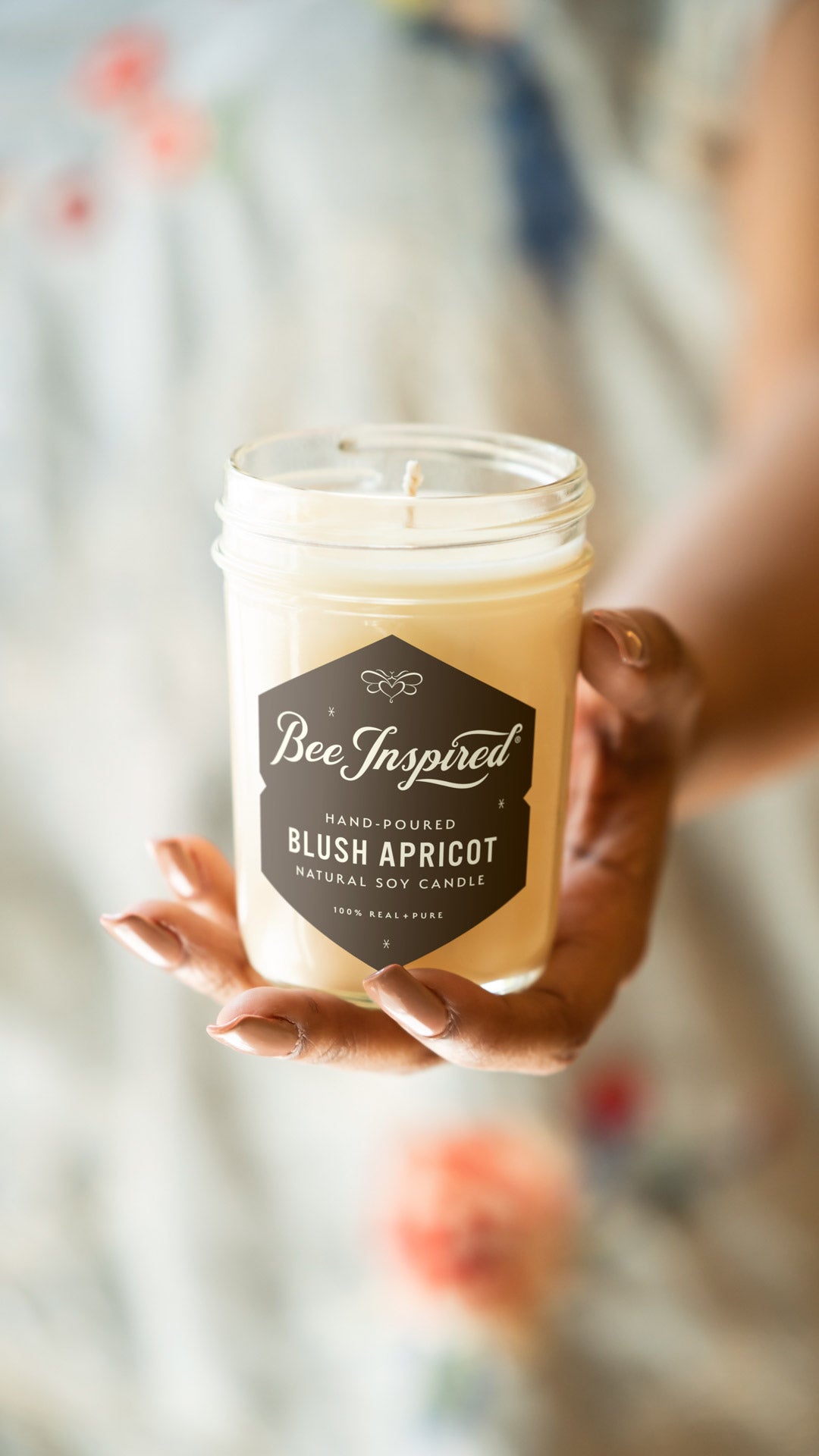 Blush Apricot jelly jar candle held in hand 