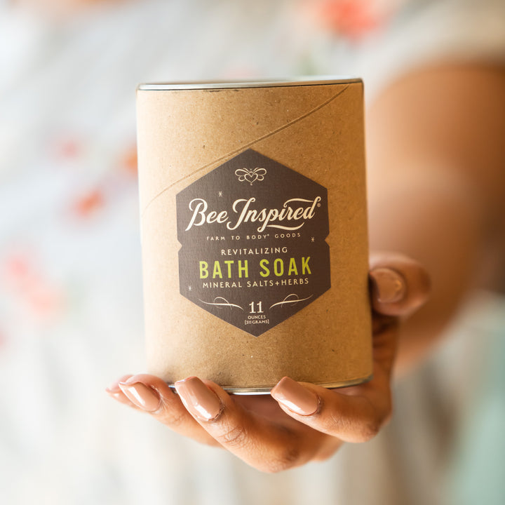 Revitalizing bath soak in hand 