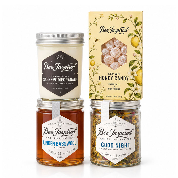 Bee Inspired Bee Well Gift set with honey, tea, lemon honey candy and sage candle on white seemless