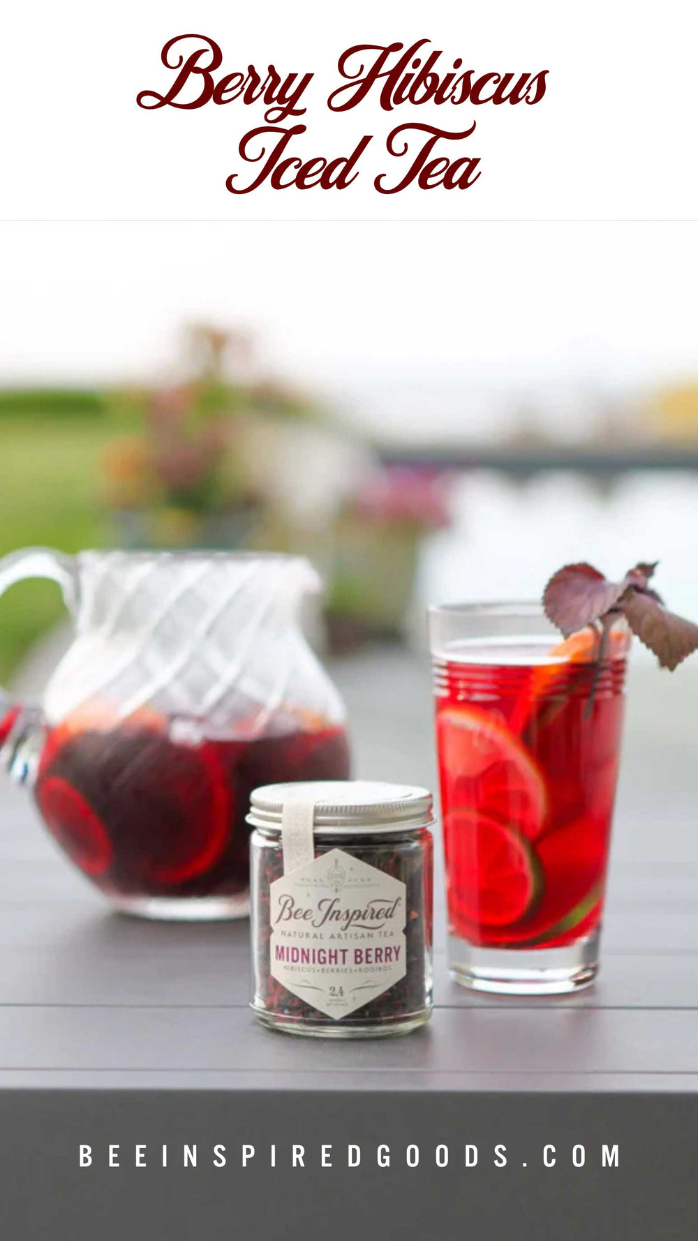 Berry Hibiscus Iced Tea with a pitcher and glass on a table outdoors, featuring Bee Inspired Goods branding.