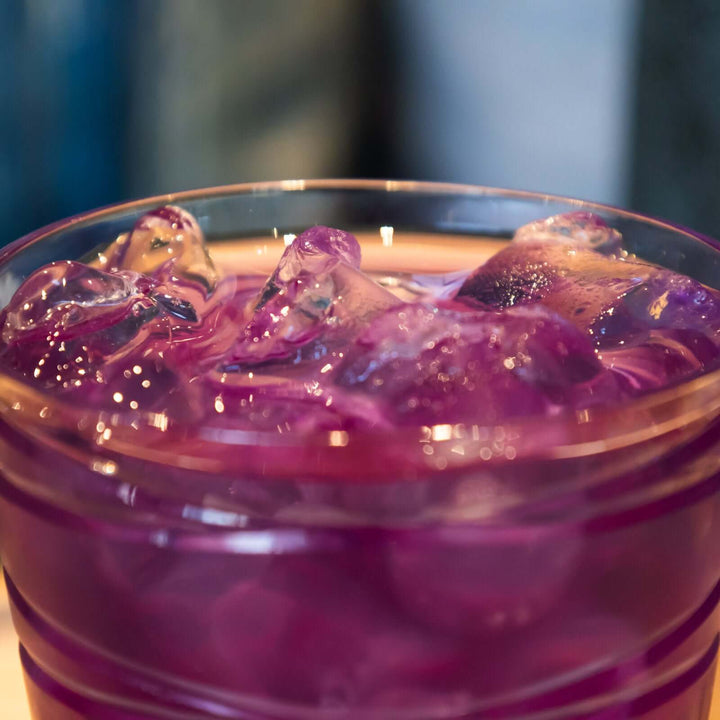 close-up of glass of fuchsia Blue Butterfly iced tea