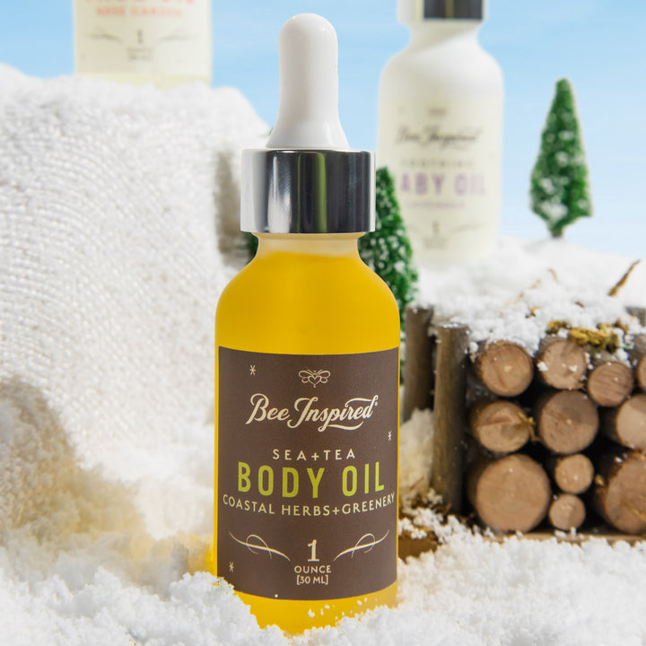 sea and tea body oil in a winter setting