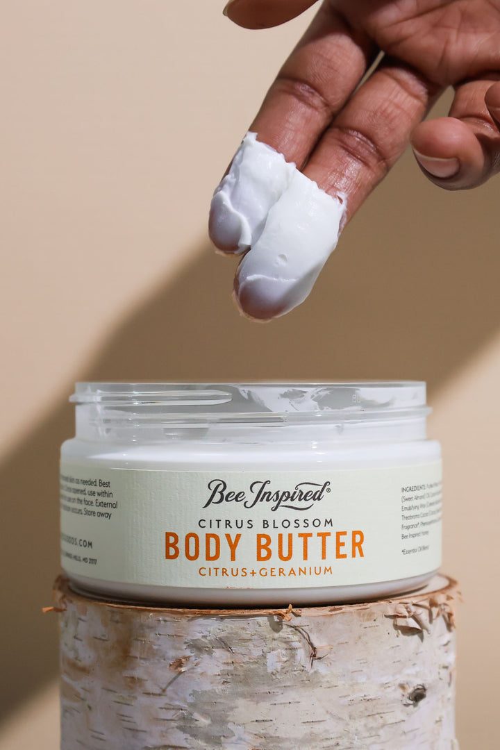 Taking Citrus Blossom body butter from the jar