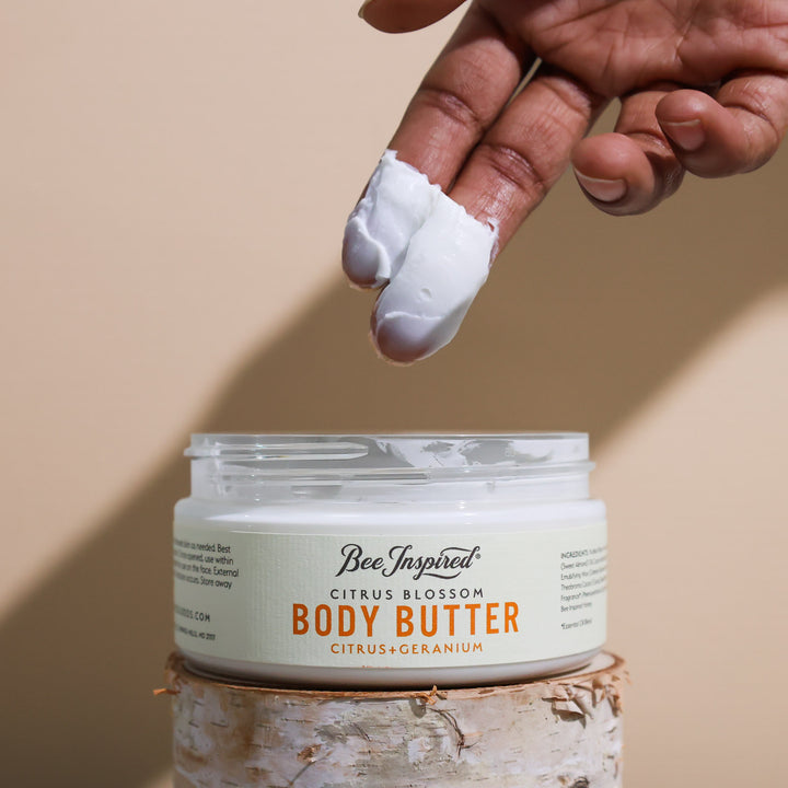 Taking Citrus Blossom body butter from the jar