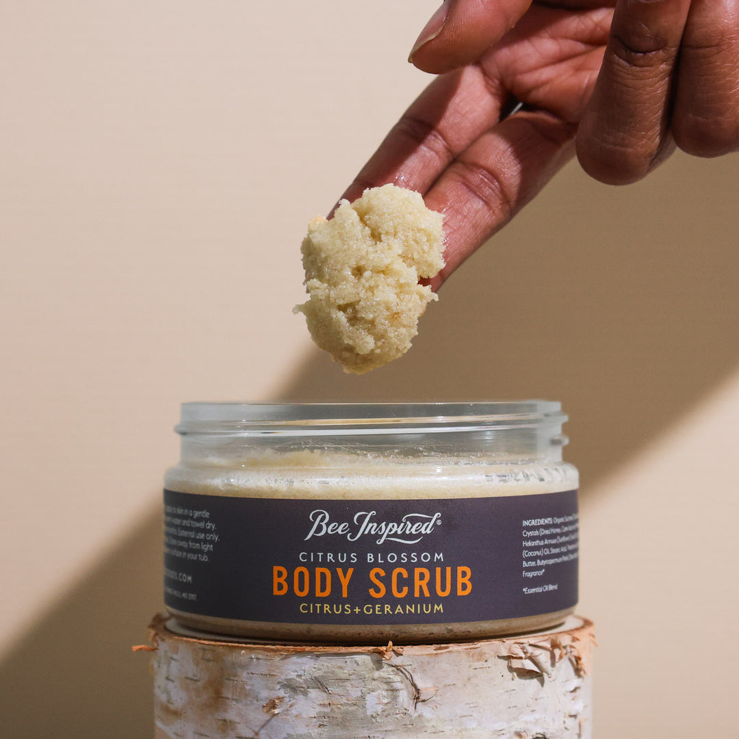 Taking Citrus Blossom body scrub from the jar