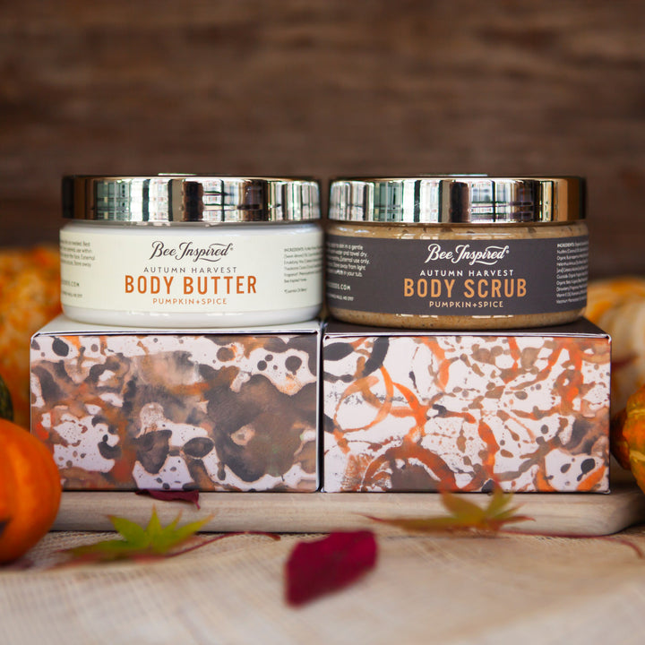 Autumn Harvest butter and scrub duo on boxes with pumpkins 