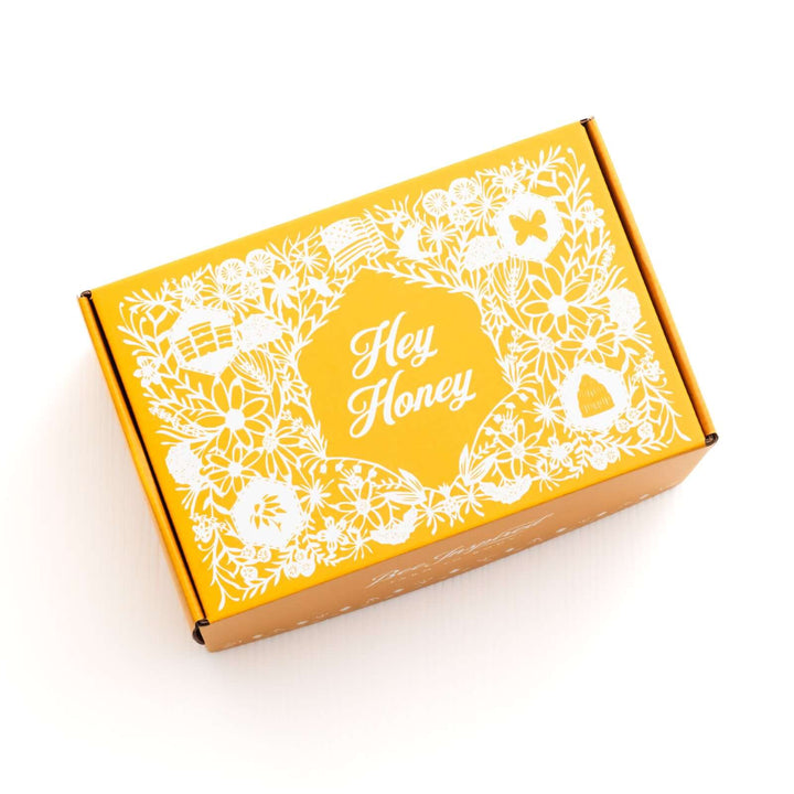 Yellow Hey Honey box by Bee Inspired against white 