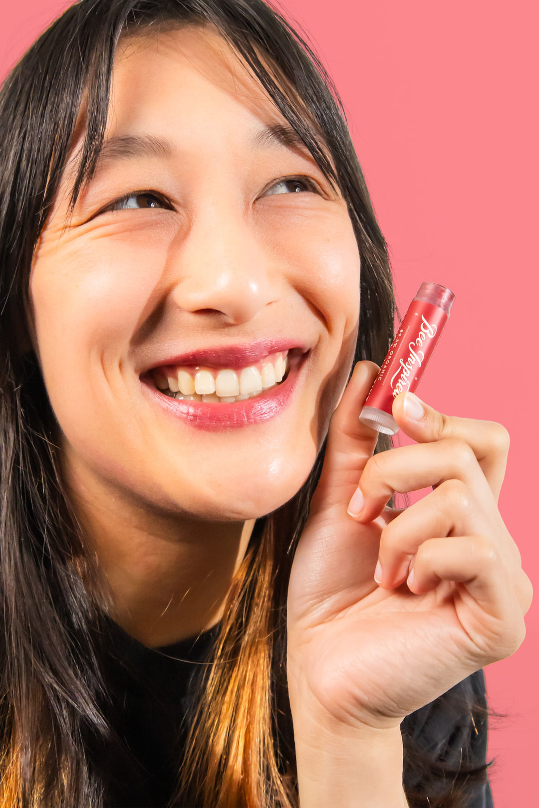 holding Cranberry lip tint