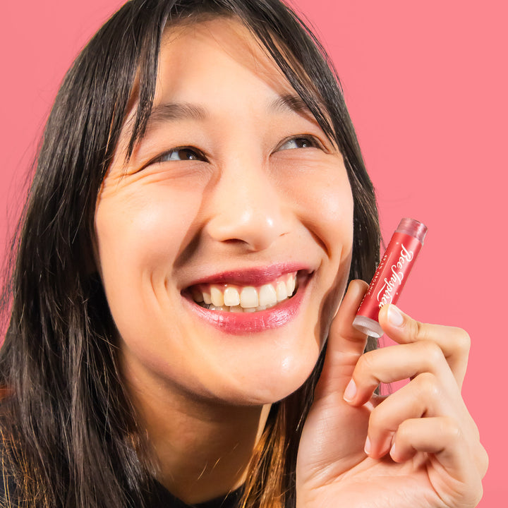 holding Cranberry lip tint