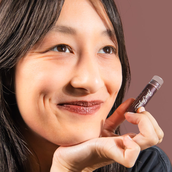 holding Sunflower lip tint