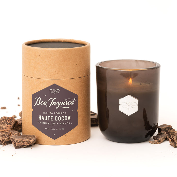 Haute Cocoa luxe candle with chocolate on white 