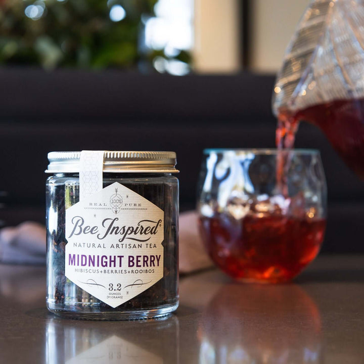 pouring a glass of iced Midnight Berry tea