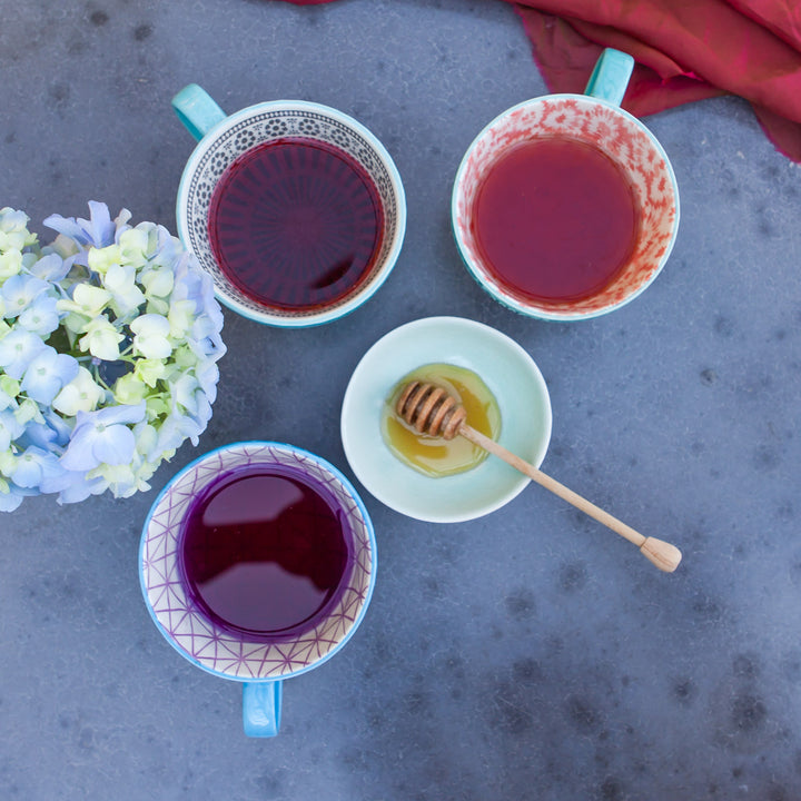 aerial view of mixologists tea set brewed in teacups