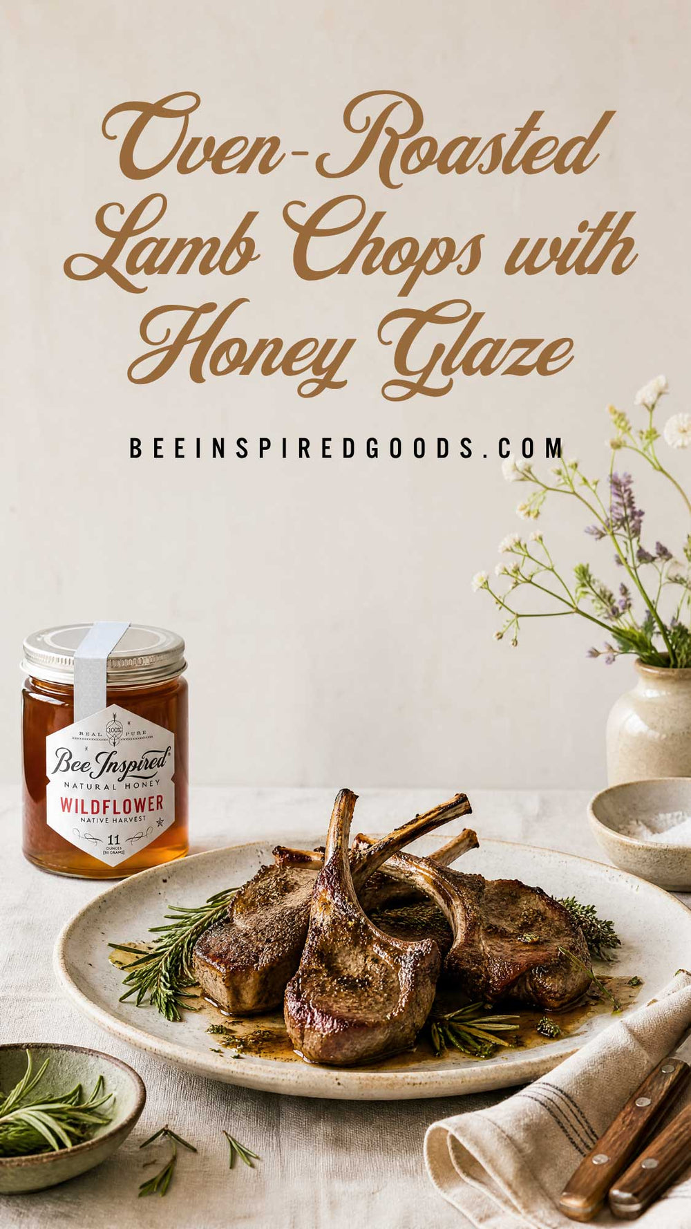 Oven-roasted lamb chops with a honey glaze served on a white plate, with a jar of Bee Inspired Goods Wildflower honey and decorative flowers in the background. Text at the top reads 'Oven-Roasted Lamb Chops with Honey Glaze' and 'BEEINSPIREDGOODS.