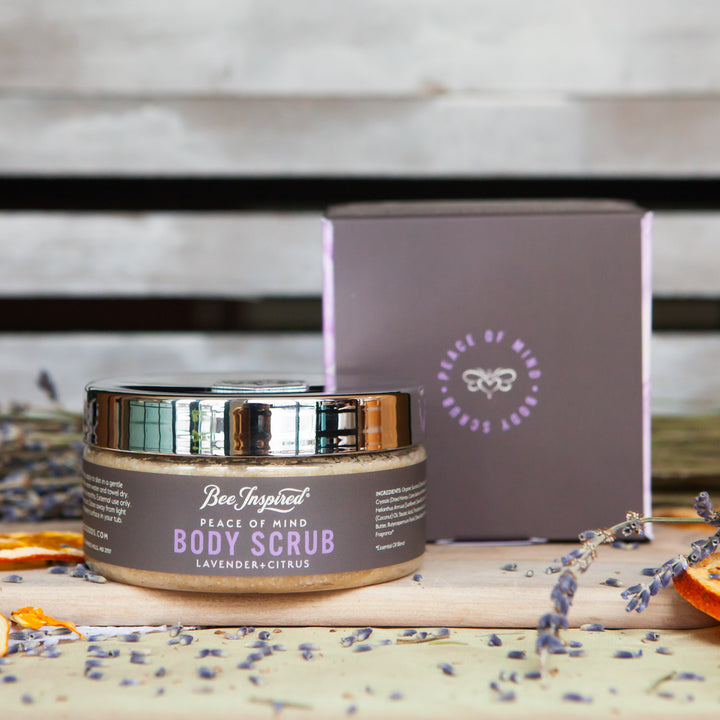 peace body scrub with its box, lavender, and orange slices