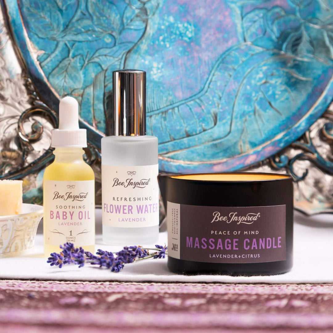 Peace of Mind massage candle, baby oil, and flower water on set 