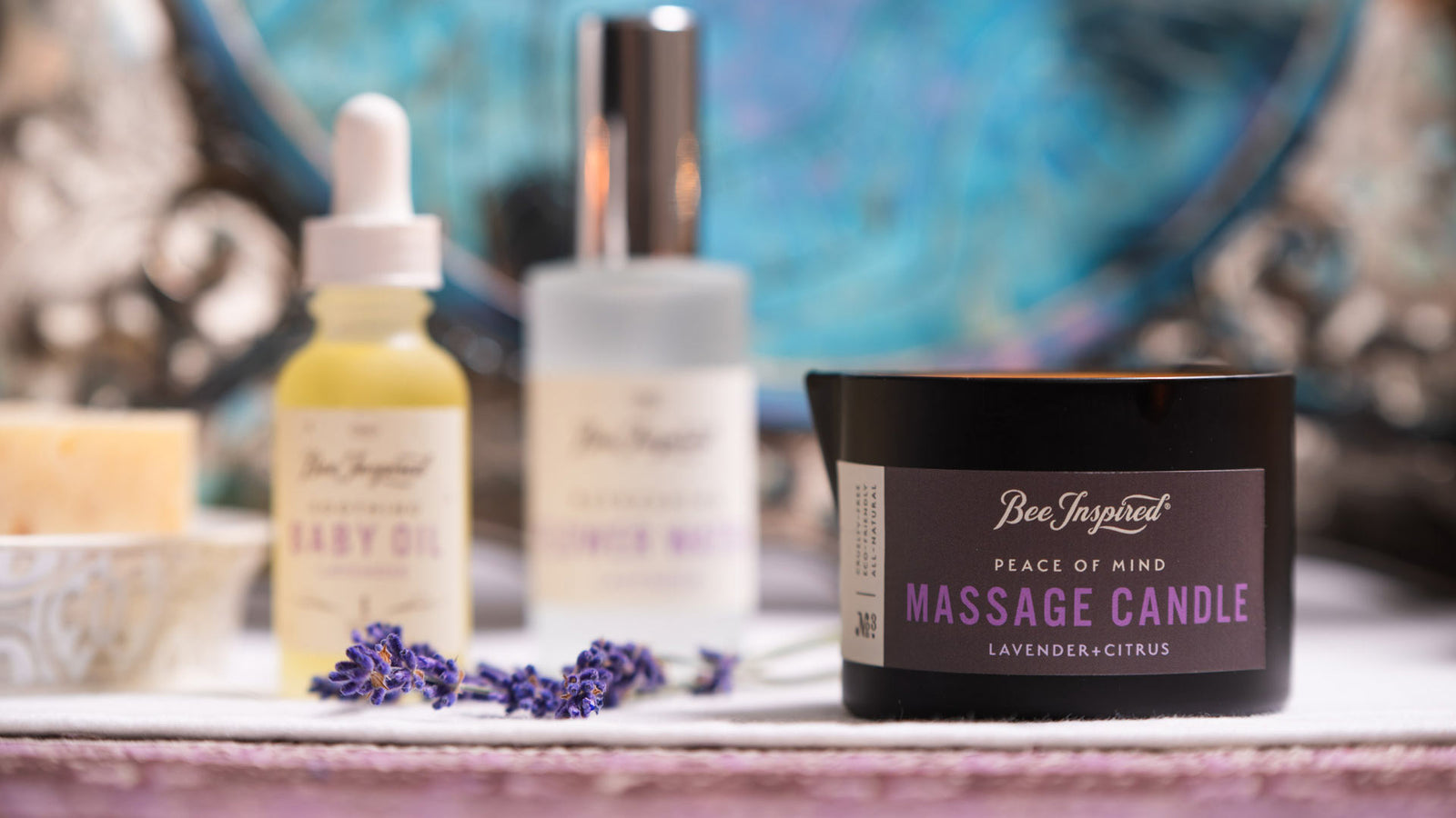 peace of mind massage candle on a boudoir set with lavender