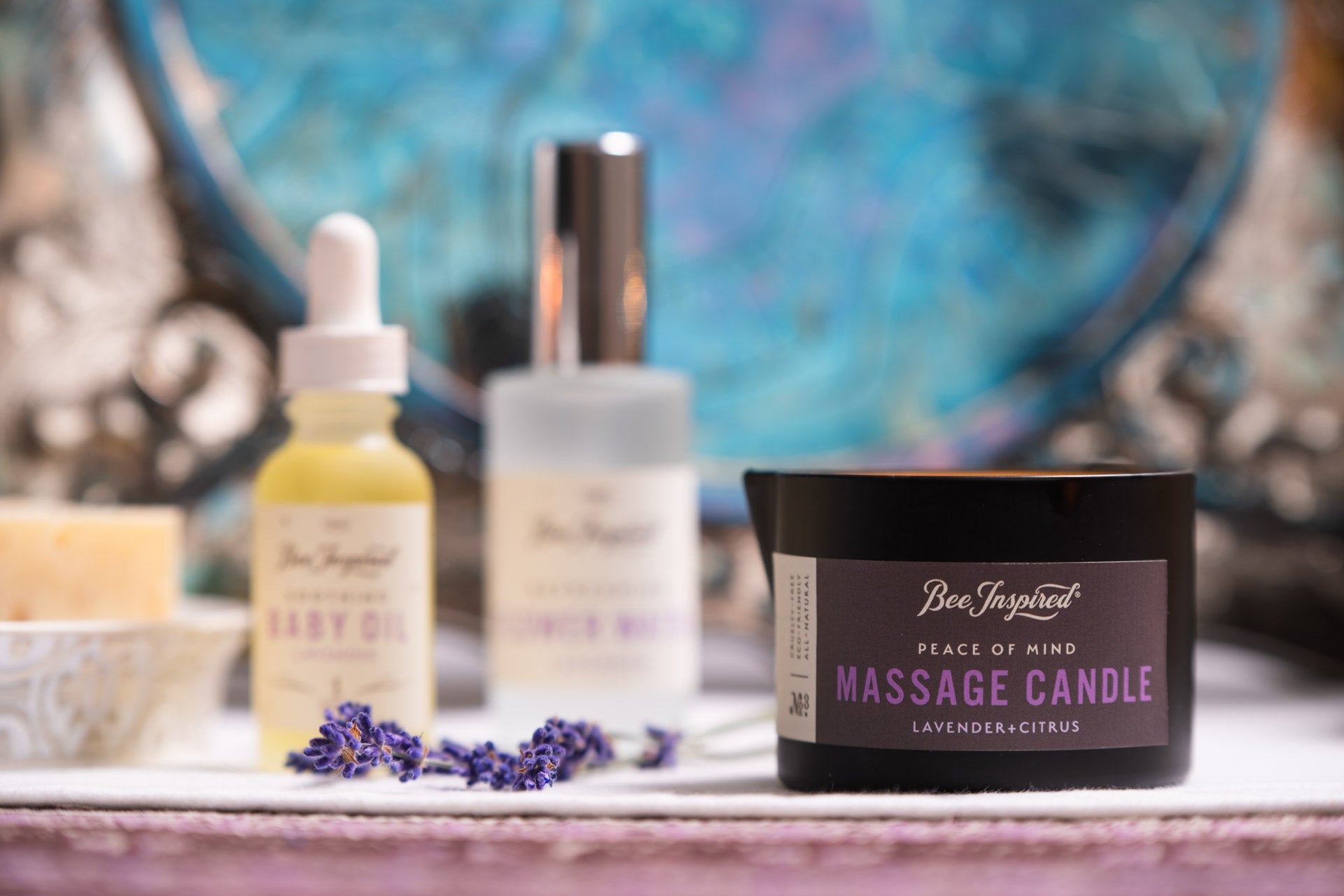 bee inspired peace of mind massage candle on a boudoir set