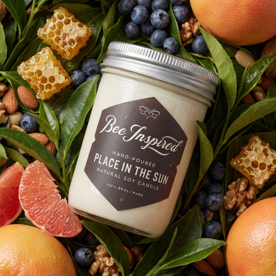 Bee-Inspired candle surrounded by fruits, nuts, and honeycomb on a leafy background