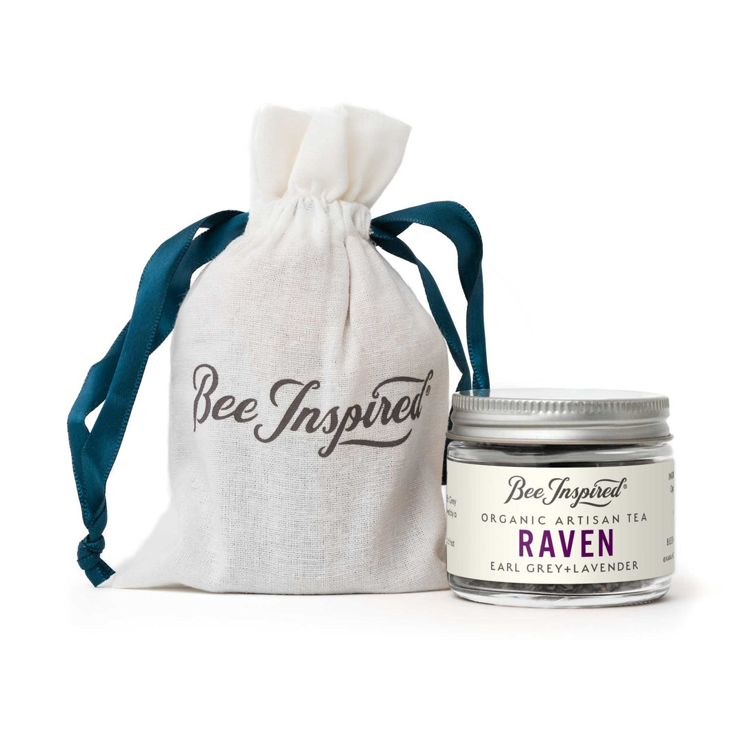 Jar of 'Bee Inspired' organic artisan tea with a matching drawstring bag on a white background