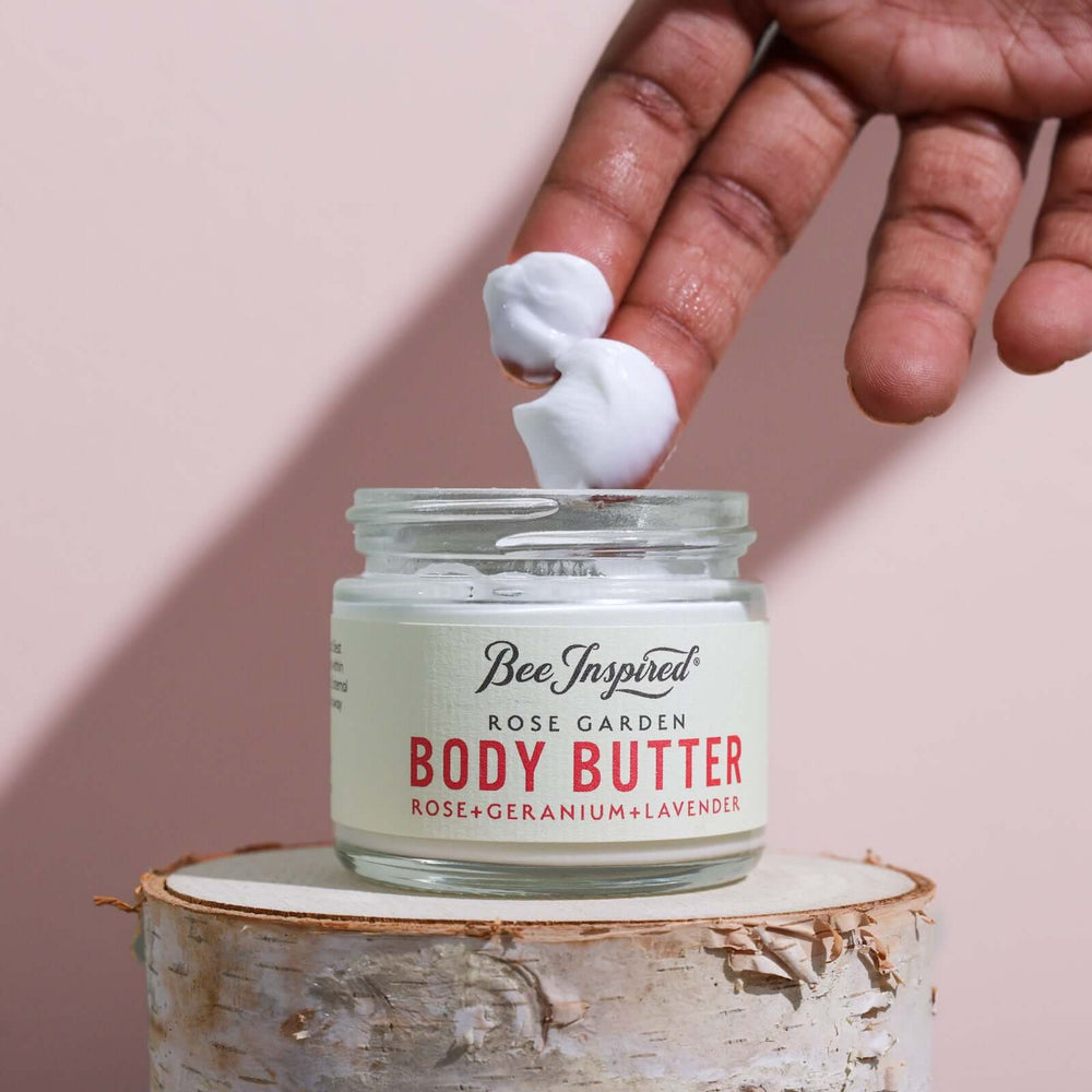 Rose Garden body butter on fingers