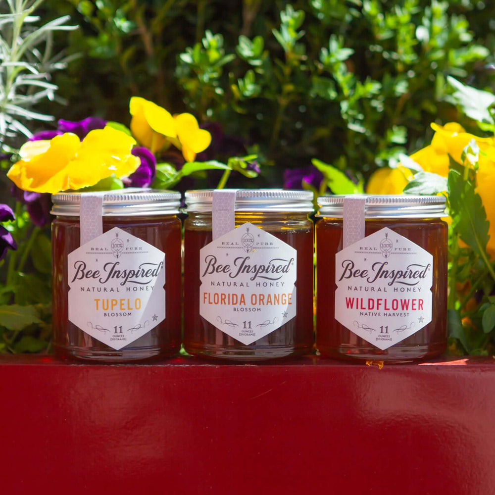 Bee Inspired Honey Royale set against wildflowers