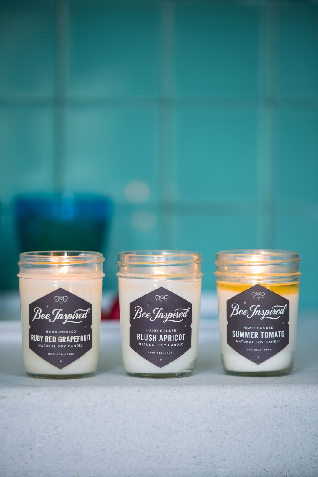 Summer jelly jar candle set burning in bathroom 