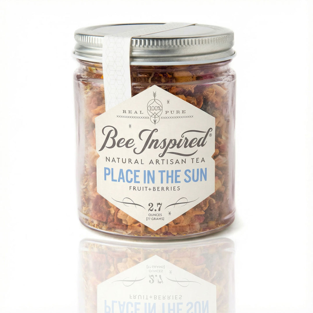 Jar of 'Bee Inspired' natural artisan tea with a white label on a white background