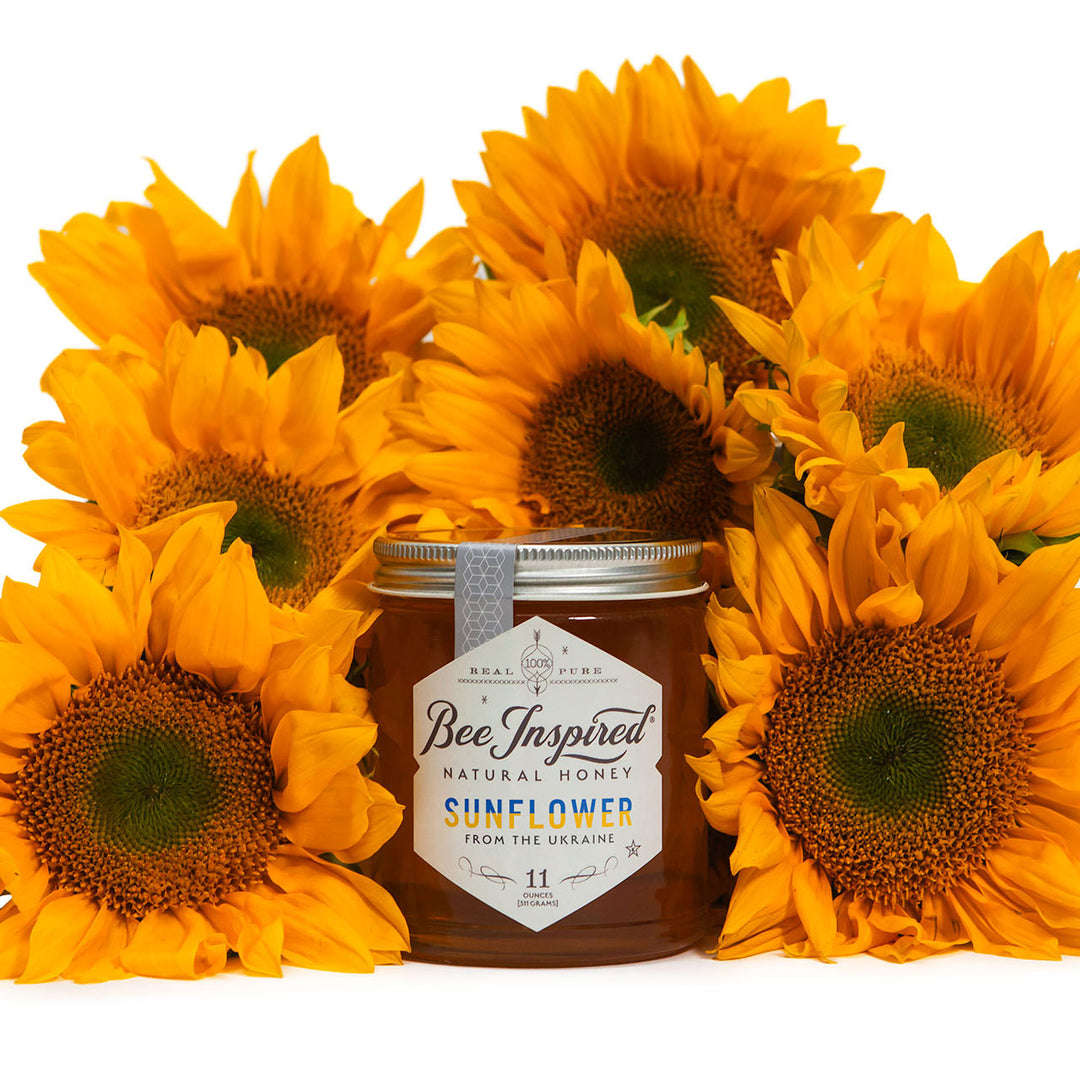 ukranian sunflower honey in front of sunflowers