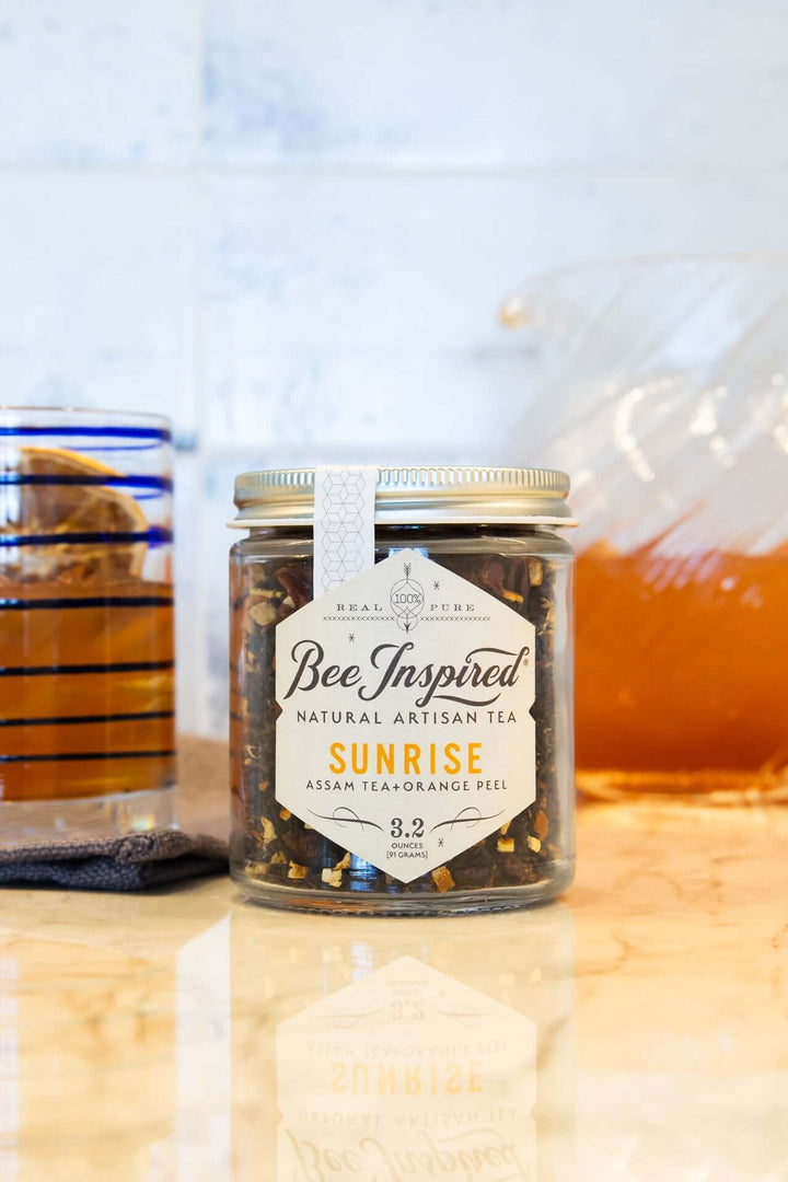 loose-leaf Sunrise Assam tea with a glass of iced tea