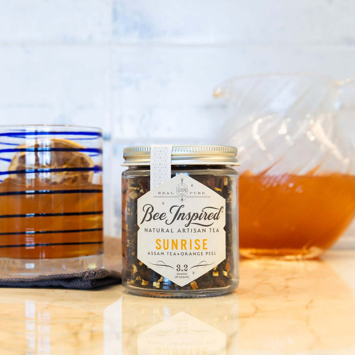 loose-leaf Sunrise Assam tea with a glass of iced tea