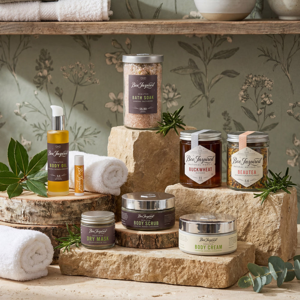Collection of natural skincare products on a wooden display with a floral wallpaper background.