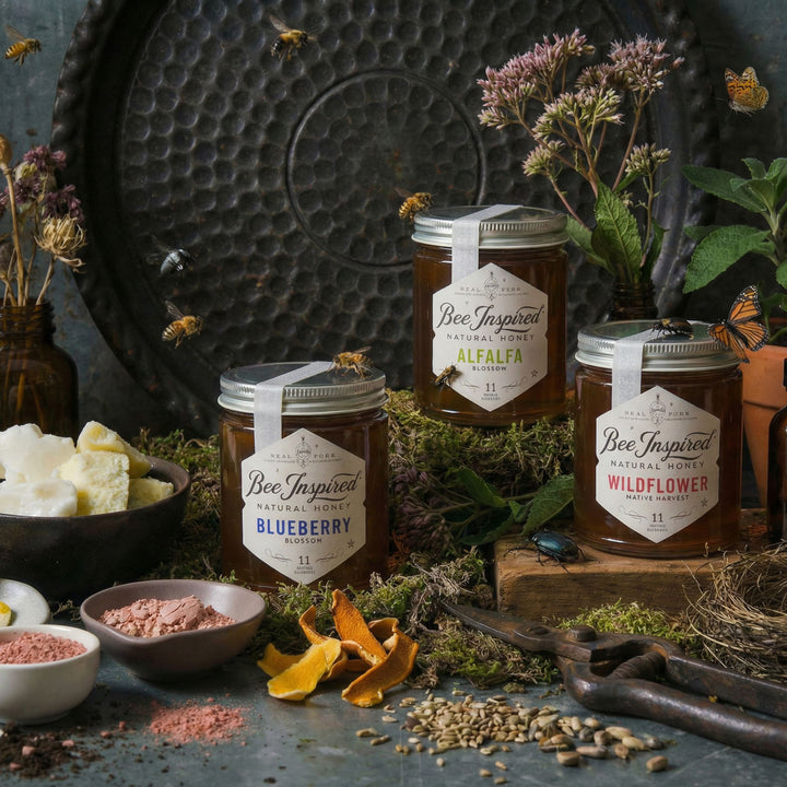 Bee Inspired allergy support set with flowers and herbs on a rustic dark background.

