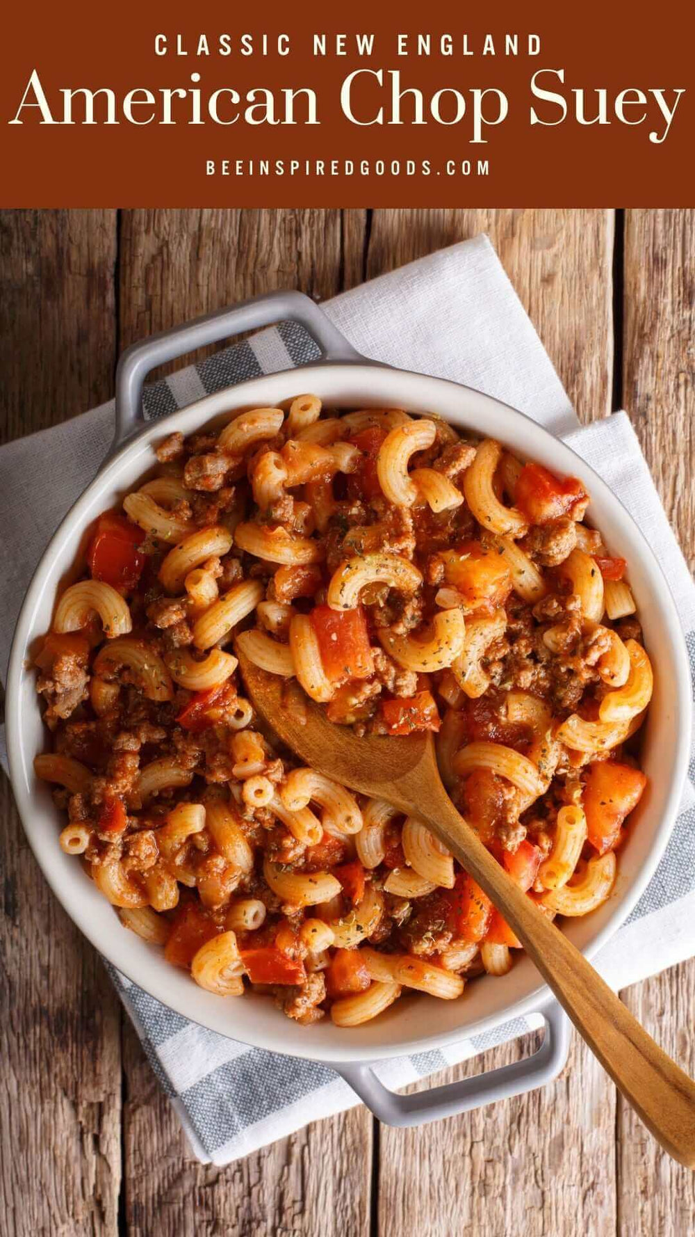 "Classic New England American Chop Suey beeinspiredgoods.com" with a bowl of chop suey on a wooden table 