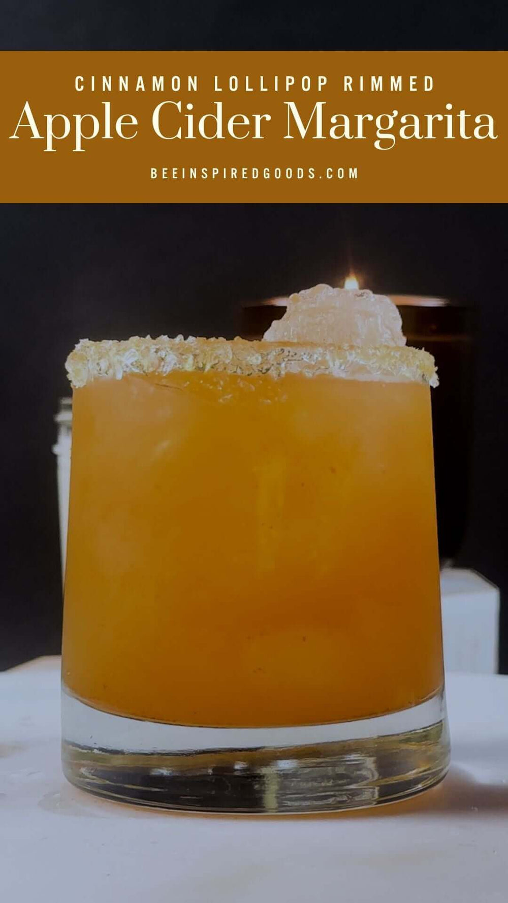 "Cinnamon Lollipop Rimmed Apple Cider Margarita beeinspiredgoods.com" with a cocktail 