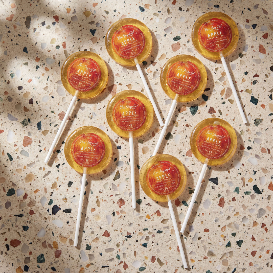 apples and honey lollipops on terazzo counter