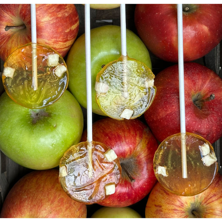 Apple honey lollipops with red and green apples 