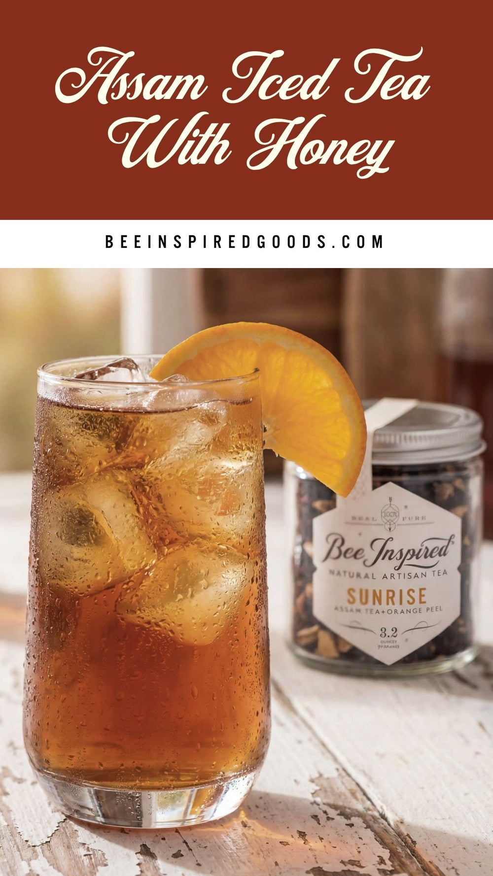 Assam iced tea with honey in a glass with a jar of Bee Inspired Goods tea in the background.