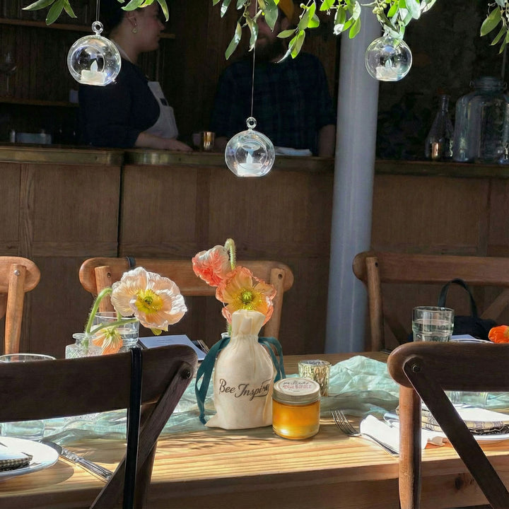 Baby Shower with honey parrty favors in the center of the table.