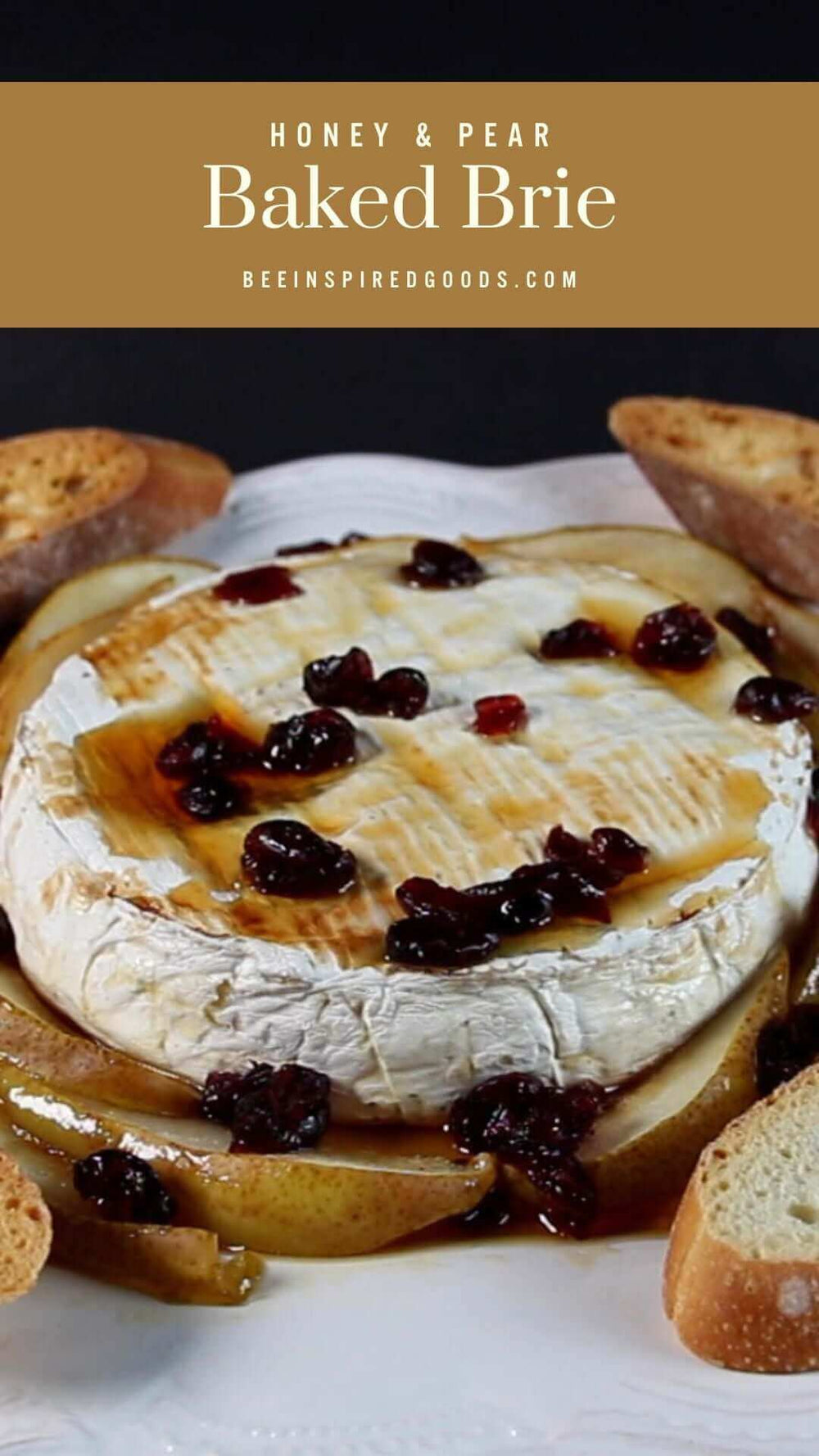 "Honey & Pear Baked Brie beeinspiredgoods.com" with a wheel of brie cheese drizzled with honey and dried berries with bread and pears